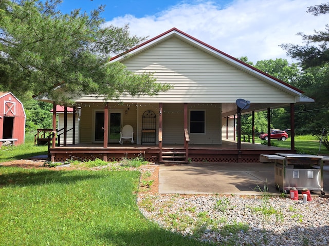 4160 S Vaughn Lake Rd, Glennie, MI 48737 - view of front of property with a front yard and covered porch