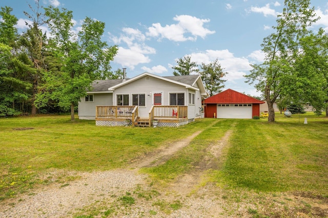 2731 Gregory St, Lewiston, MI 49756 - single story home featuring an outdoor structure, a detached garage, a deck, and a front yard