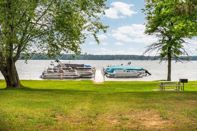 2731 Gregory St, Lewiston, MI 49756 - dock featuring a water view and a yard