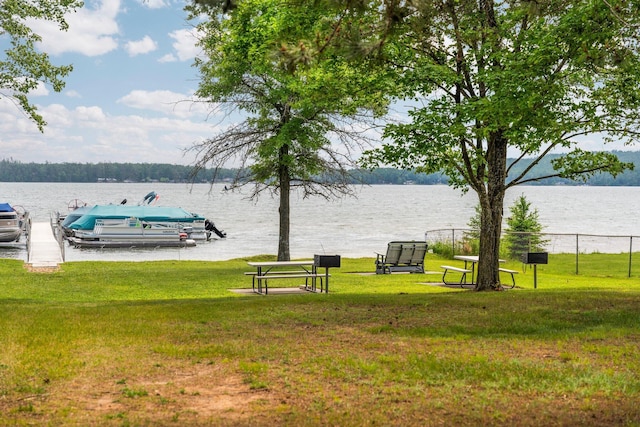 2731 Gregory St, Lewiston, MI 49756 - surrounding community with a water view, a yard, and a boat dock