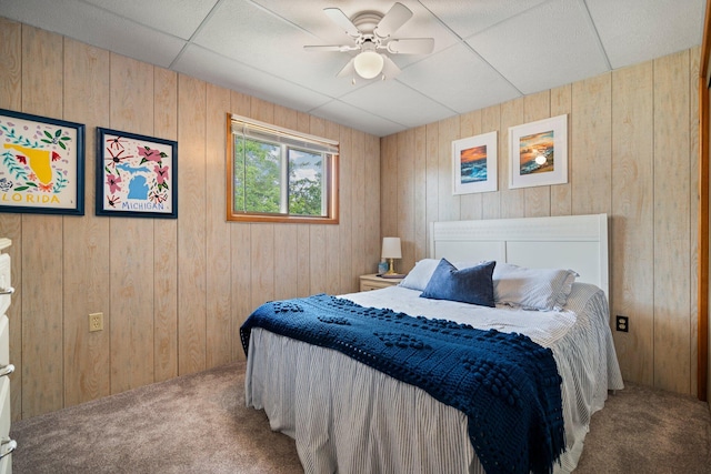 2731 Gregory St, Lewiston, MI 49756 - bedroom featuring carpet floors, wood walls, and a ceiling fan