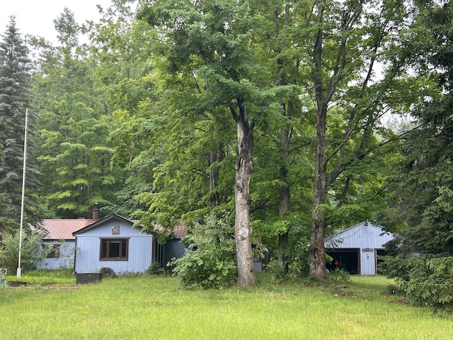 16831 Moores Landing Rd, Lachine, MI 49753 - view of yard with an outbuilding and a forest view