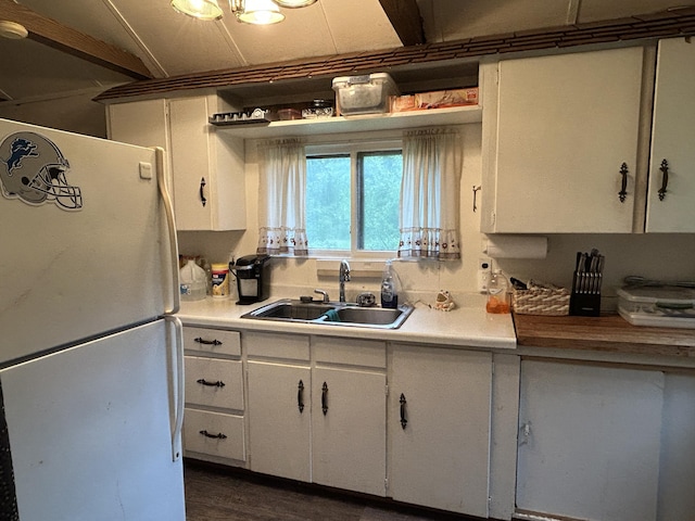 16831 Moores Landing Rd, Lachine, MI 49753 - kitchen featuring freestanding refrigerator, white cabinetry, and light countertops
