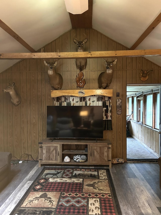 16831 Moores Landing Rd, Lachine, MI 49753 - living room with wooden walls, wood finished floors, and vaulted ceiling