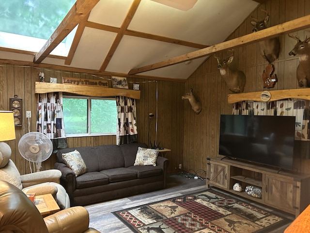 16831 Moores Landing Rd, Lachine, MI 49753 - living room with lofted ceiling, a skylight, and wooden walls