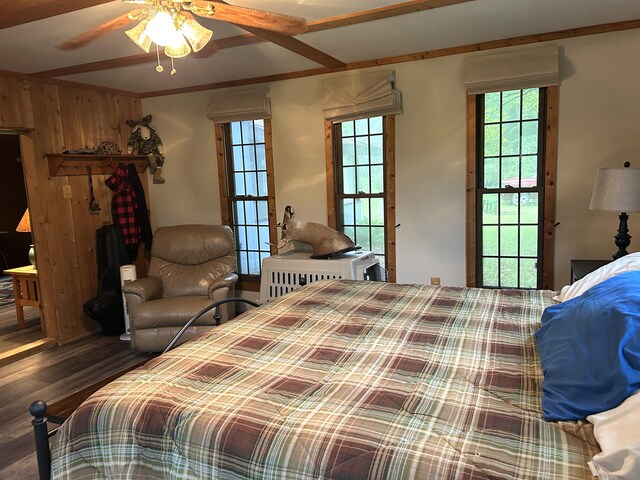 16831 Moores Landing Rd, Lachine, MI 49753 - bedroom with wood finished floors, multiple windows, and wood walls