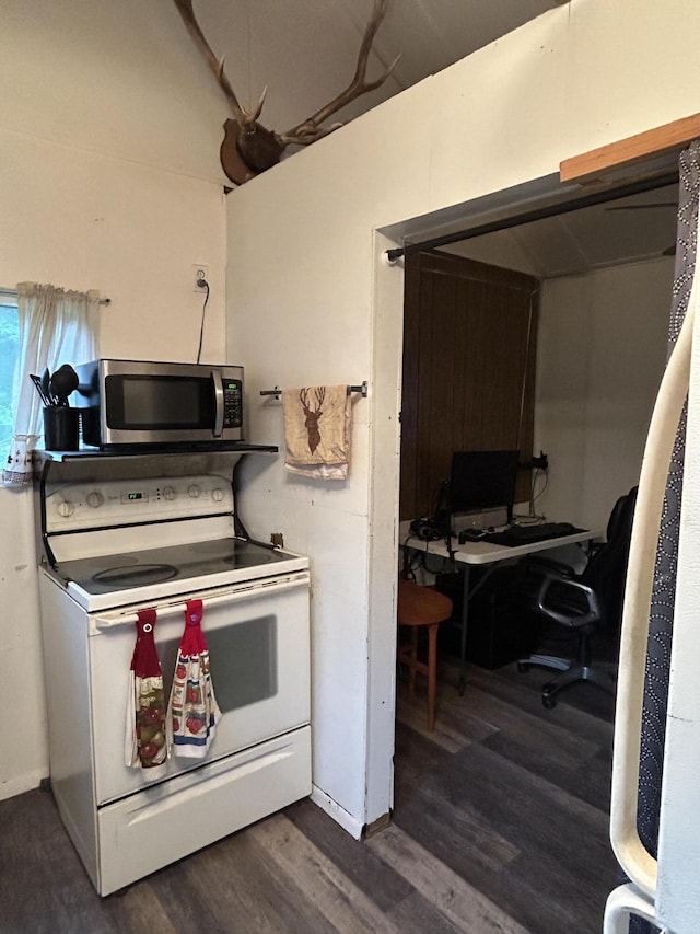 16831 Moores Landing Rd, Lachine, MI 49753 - kitchen with white electric range oven, stainless steel microwave, dark wood finished floors, and a desk