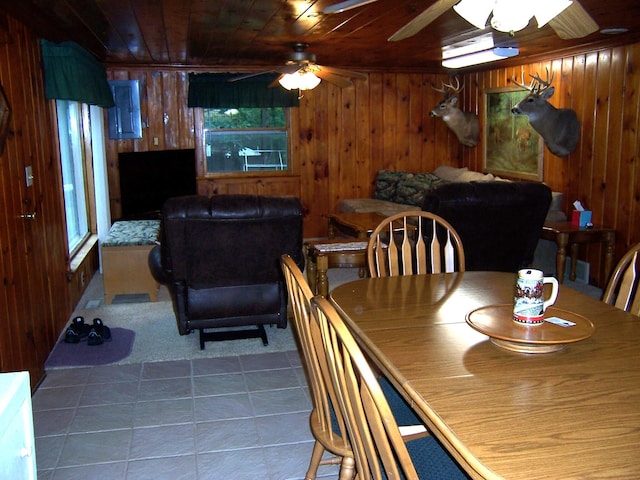 409 Marvin Rd, Roscommon, MI 48653 - tiled dining room featuring wood walls, ceiling fan, and wooden ceiling
