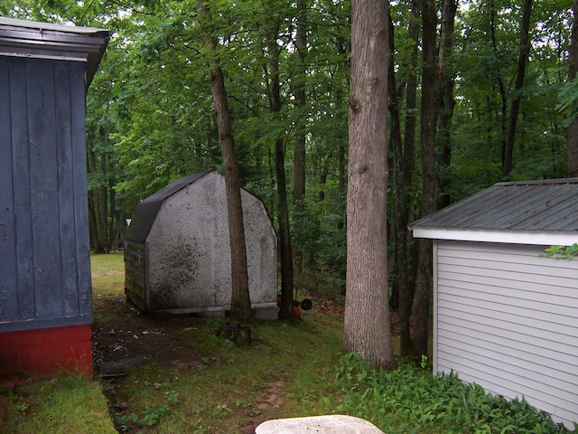 409 Marvin Rd, Roscommon, MI 48653 - view of yard featuring a storage shed