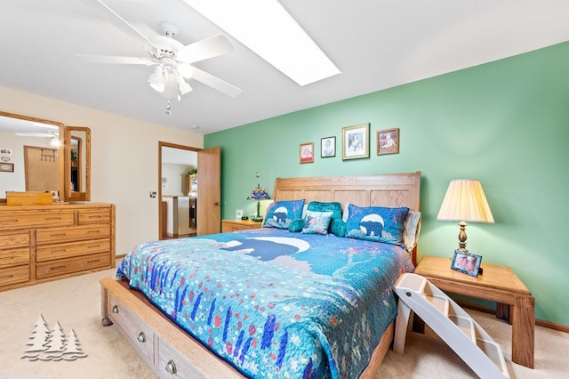 881 N Red Oak Rd, Lewiston, MI 49756 - bedroom with carpet flooring, a skylight, and ceiling fan