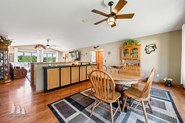 881 N Red Oak Rd, Lewiston, MI 49756 - dining space with ceiling fan, vaulted ceiling, and light wood-type flooring