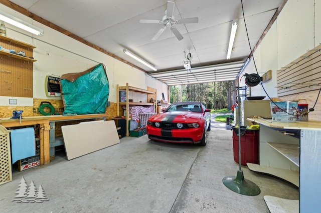 881 N Red Oak Rd, Lewiston, MI 49756 - garage with a workshop area and ceiling fan