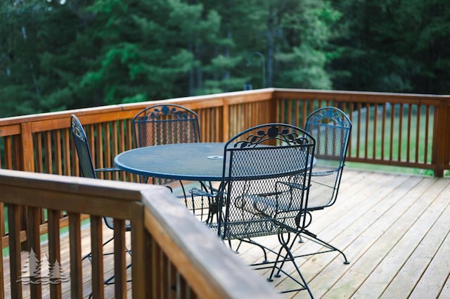 881 N Red Oak Rd, Lewiston, MI 49756 - wooden deck featuring outdoor dining area
