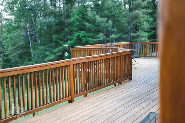 881 N Red Oak Rd, Lewiston, MI 49756 - wooden deck featuring view of wooded area