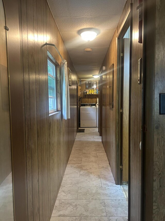 15939 Hiawatha Trl, Atlanta, MI 49709 - hall with wood walls and a textured ceiling