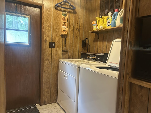 15939 Hiawatha Trl, Atlanta, MI 49709 - laundry room with washing machine and dryer and wooden walls