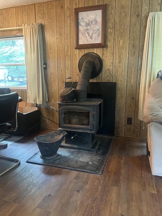 15939 Hiawatha Trl, Atlanta, MI 49709 - detailed view of wooden walls, a wood stove, and wood finished floors