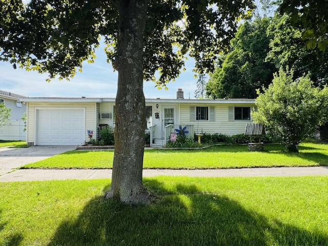 326 N Addison St, Alpena, MI 49707 - ranch-style house with a garage, a front yard, driveway, and a chimney
