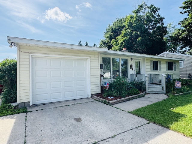326 N Addison St, Alpena, MI 49707 - single story home with concrete driveway and covered porch