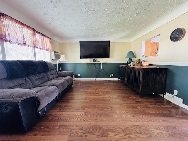 326 N Addison St, Alpena, MI 49707 - living room with a textured ceiling and wood finished floors
