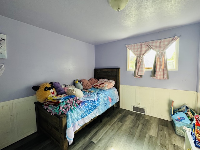 326 N Addison St, Alpena, MI 49707 - bedroom with wood finished floors