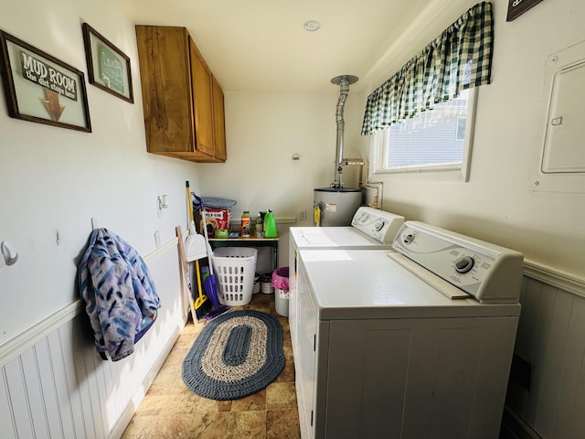 326 N Addison St, Alpena, MI 49707 - laundry room with cabinet space, washing machine and dryer, wainscoting, and electric water heater