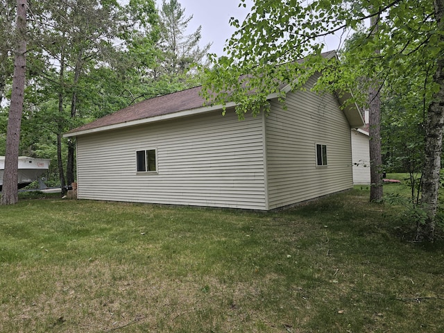 14911 Kings Ln, Ocqueoc, MI 49759 - view of property exterior with a yard