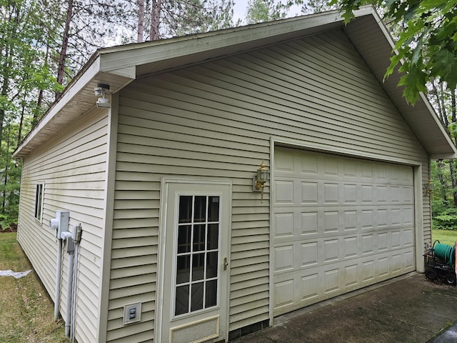 14911 Kings Ln, Ocqueoc, MI 49759 - view of home's exterior with a garage and an outdoor structure