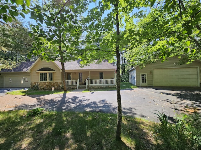 14911 Kings Ln, Ocqueoc, MI 49759 - view of front of property featuring a porch and driveway