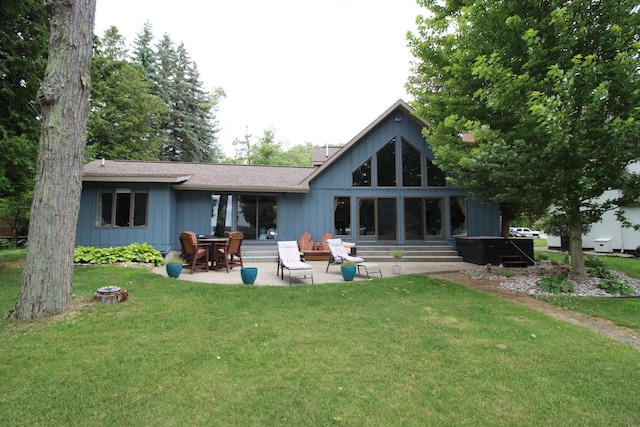 2150 Danish Landing Rd, Grayling, MI 49738 - back of property featuring a patio and a yard
