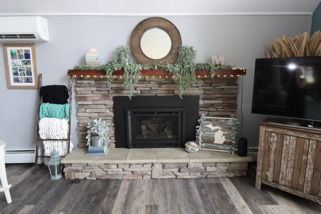2150 Danish Landing Rd, Grayling, MI 49738 - living area featuring an AC wall unit, baseboard heating, wood finished floors, and a stone fireplace