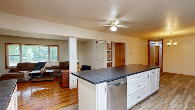 7090 Nancy K Dr, Hale, MI 48739 - kitchen with dark countertops, dishwasher, open floor plan, light wood-style floors, and a textured ceiling
