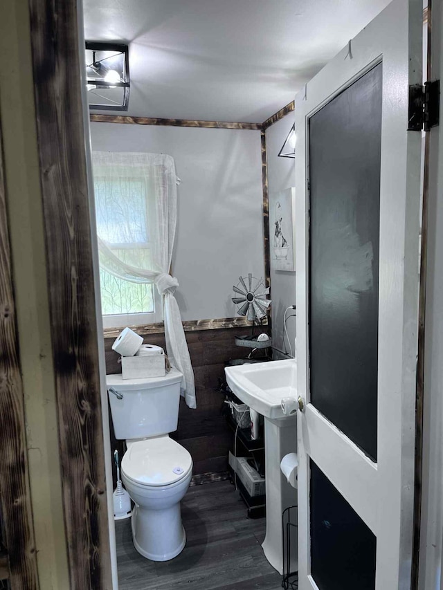 4130 Werth Rd, Alpena, MI 49707 - half bathroom featuring toilet and wood finished floors