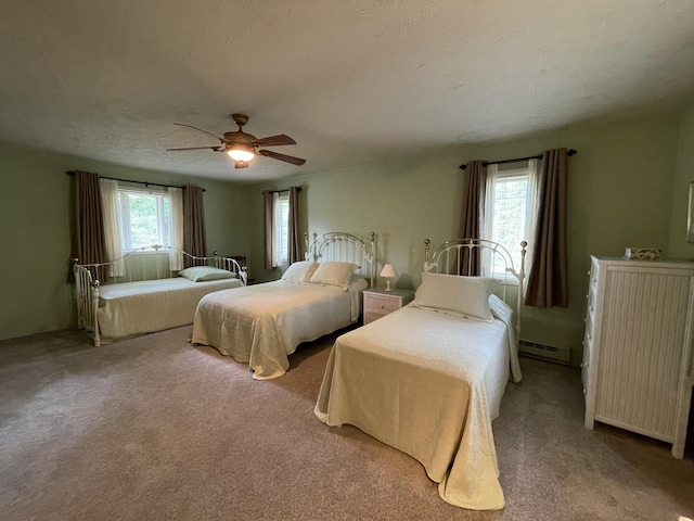 982 Shaggy Bark Ct, Gaylord, MI 49735 - carpeted bedroom featuring baseboard heating and a ceiling fan