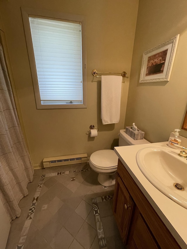 982 Shaggy Bark Ct, Gaylord, MI 49735 - full bath featuring baseboard heating, vanity, tile patterned flooring, and a shower with curtain