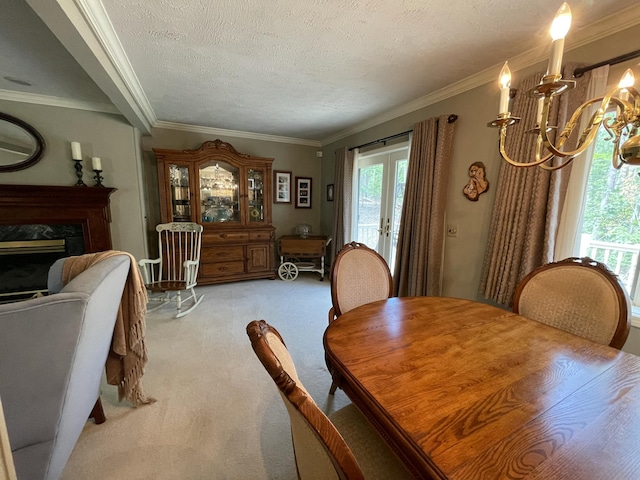 982 Shaggy Bark Ct, Gaylord, MI 49735 - dining space with crown molding, light colored carpet, a chandelier, plenty of natural light, and french doors