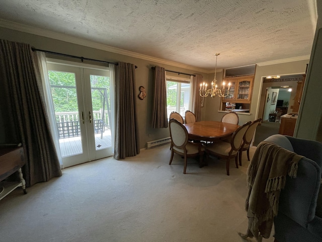 982 Shaggy Bark Ct, Gaylord, MI 49735 - dining room with a baseboard heating unit, a chandelier, a textured ceiling, french doors, and light carpet