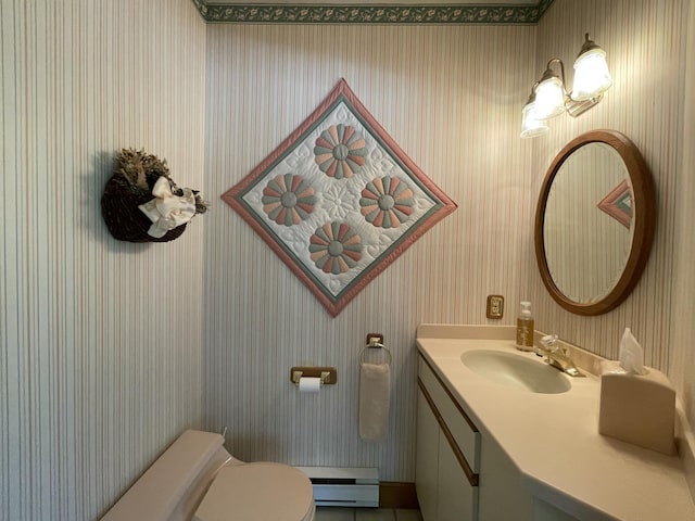 982 Shaggy Bark Ct, Gaylord, MI 49735 - bathroom featuring wallpapered walls, vanity, a baseboard heating unit, and tile patterned flooring
