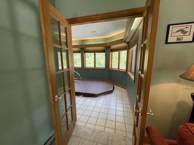 982 Shaggy Bark Ct, Gaylord, MI 49735 - doorway with crown molding and light tile patterned floors