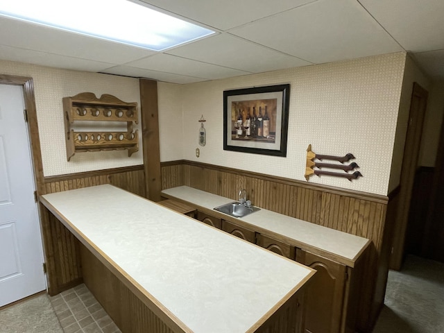 982 Shaggy Bark Ct, Gaylord, MI 49735 - bar featuring a wainscoted wall, wallpapered walls, wooden walls, and a paneled ceiling