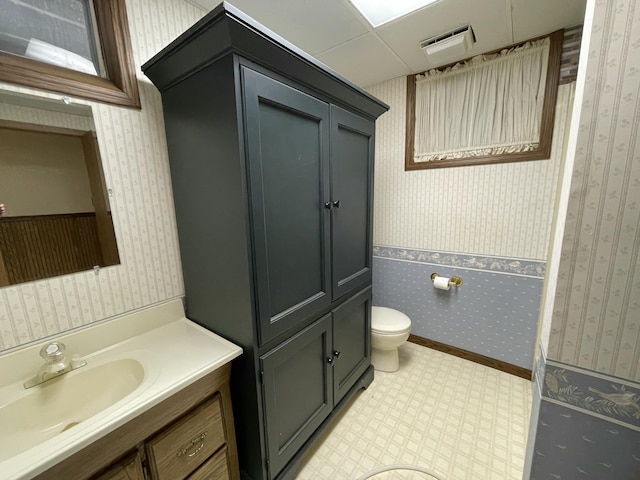 982 Shaggy Bark Ct, Gaylord, MI 49735 - full bathroom with vanity, wallpapered walls, and tile patterned floors