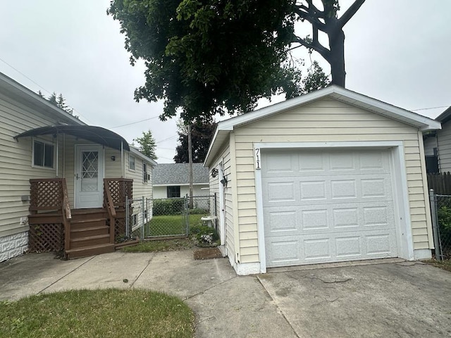 711 S 8th Ave, Alpena, MI 49707 - detached garage with driveway and a gate