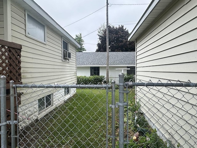 711 S 8th Ave, Alpena, MI 49707 - view of side of home with a gate