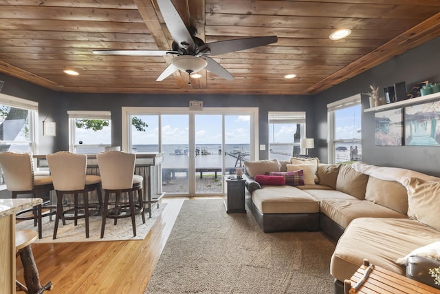 3974 W Houghton Lake Dr, Houghton Lake, MI 48629 - living area with wooden ceiling, hardwood / wood-style floors, a ceiling fan, recessed lighting, and a water view