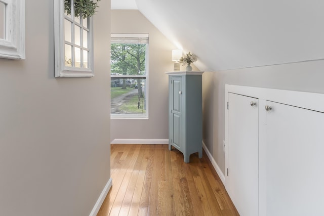 3974 W Houghton Lake Dr, Houghton Lake, MI 48629 - additional living space featuring light wood-style floors and lofted ceiling