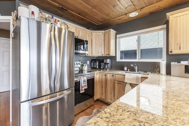 3974 W Houghton Lake Dr, Houghton Lake, MI 48629 - kitchen featuring stainless steel appliances, wooden ceiling, light brown cabinets, light stone counters, and wood finished floors