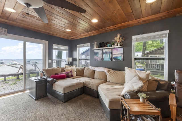 3974 W Houghton Lake Dr, Houghton Lake, MI 48629 - living area with wooden ceiling, recessed lighting, a water view, carpet flooring, and a ceiling fan