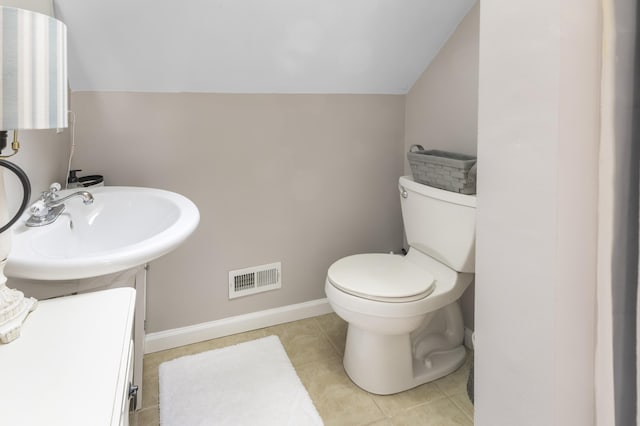 3974 W Houghton Lake Dr, Houghton Lake, MI 48629 - bathroom featuring toilet and tile patterned flooring