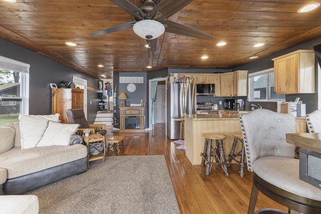 3974 W Houghton Lake Dr, Houghton Lake, MI 48629 - living room featuring wood ceiling, ceiling fan, dark wood finished floors, a fireplace, and recessed lighting