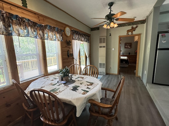 5127 Crestwood Rd, Lewiston, MI 49756 - dining space featuring light wood-style floors, ceiling fan, and a heating unit